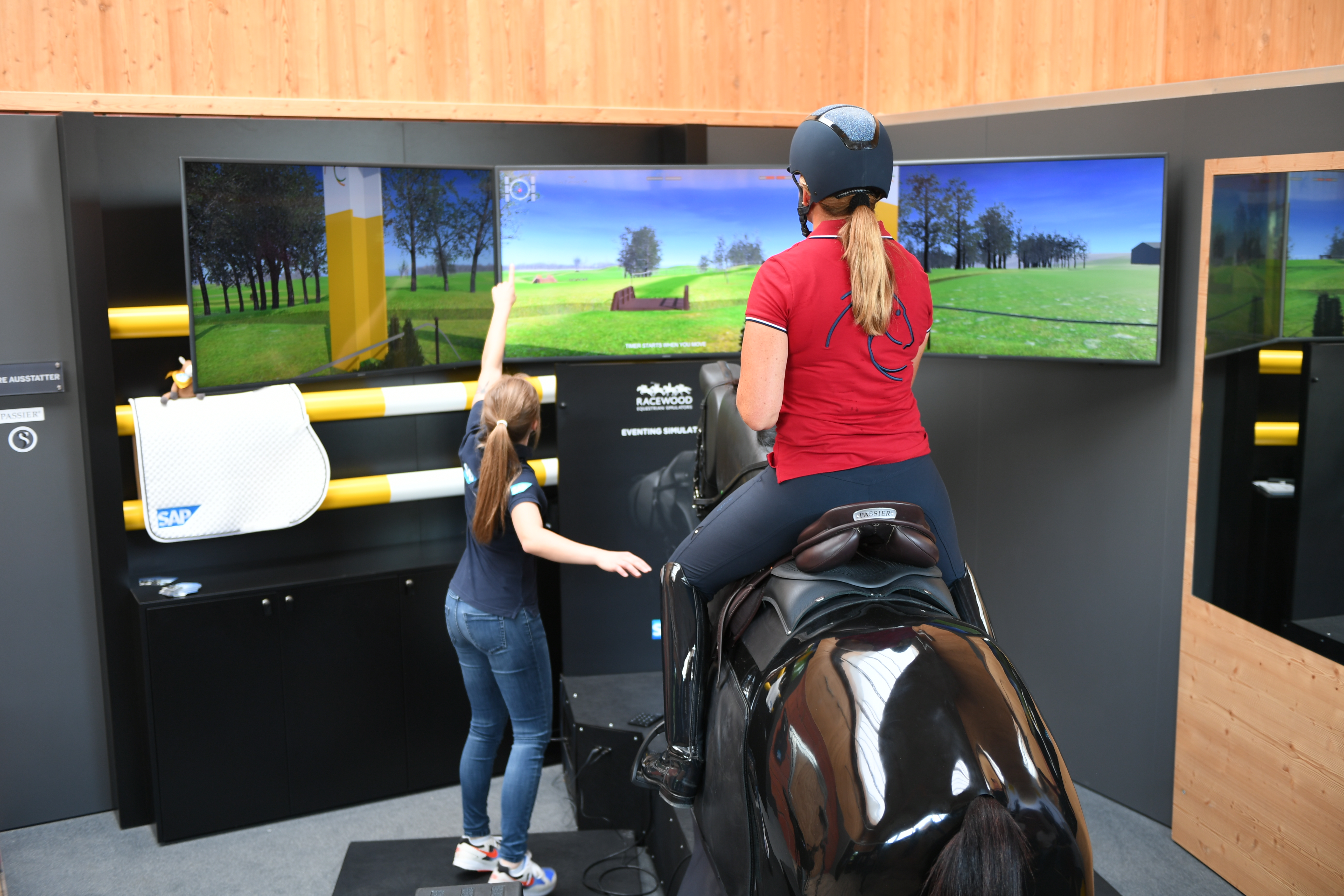Equestrians training with the riding simulator